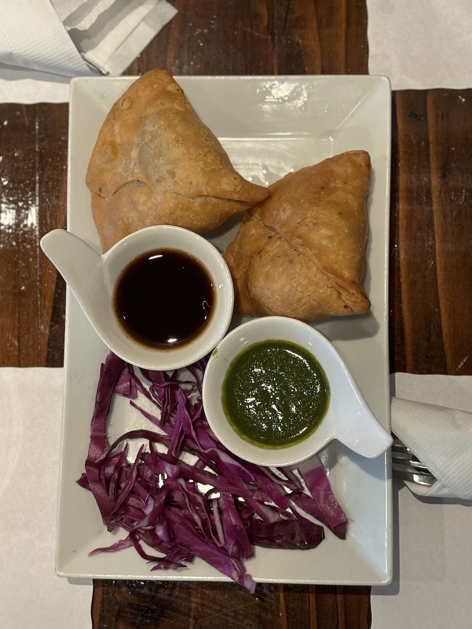 Vegetable samosas served at Taj Indian Fusion